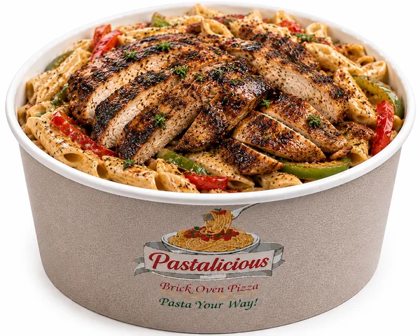 Authentic jerk chicken over penne in cream sauce